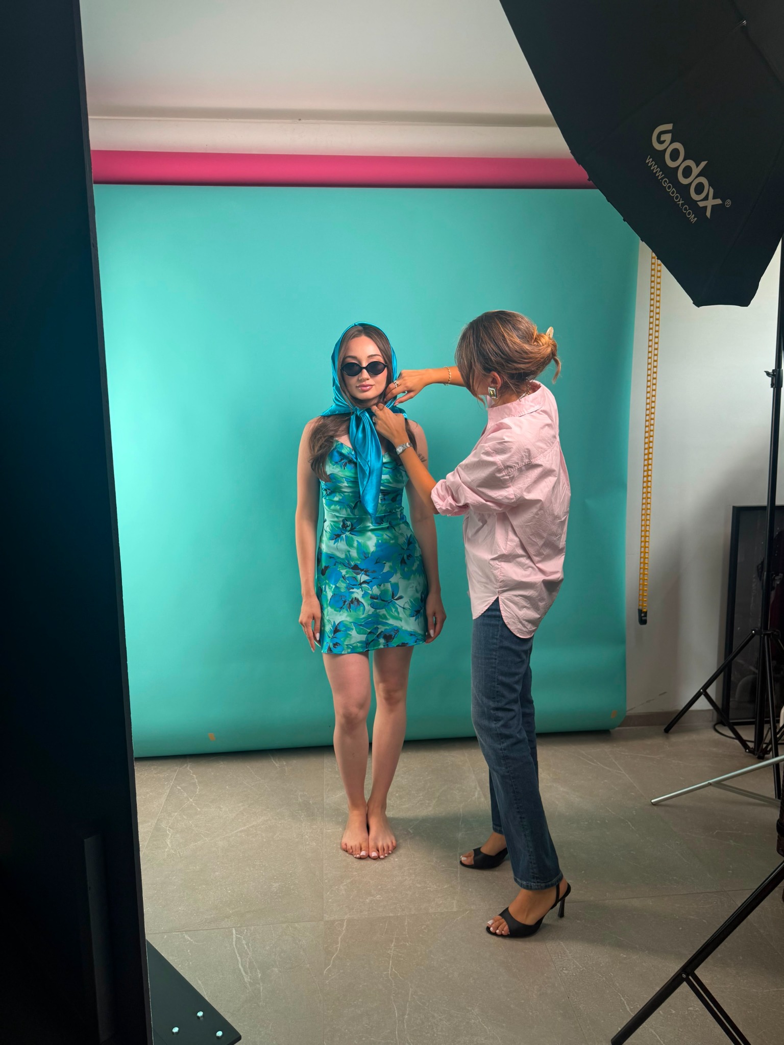 Creative direction on set with model in blue